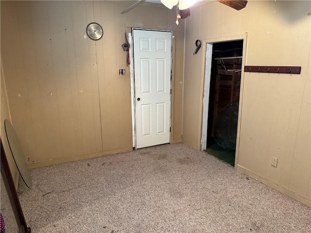 4721 Molina Dr, Corpus Christi, TX 78416 - unfurnished bedroom with carpet flooring, wooden walls, and a closet