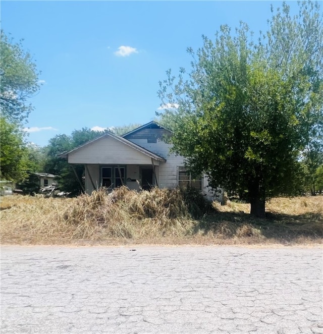 view of property hidden behind natural elements