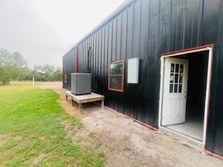 view of property exterior with a lawn