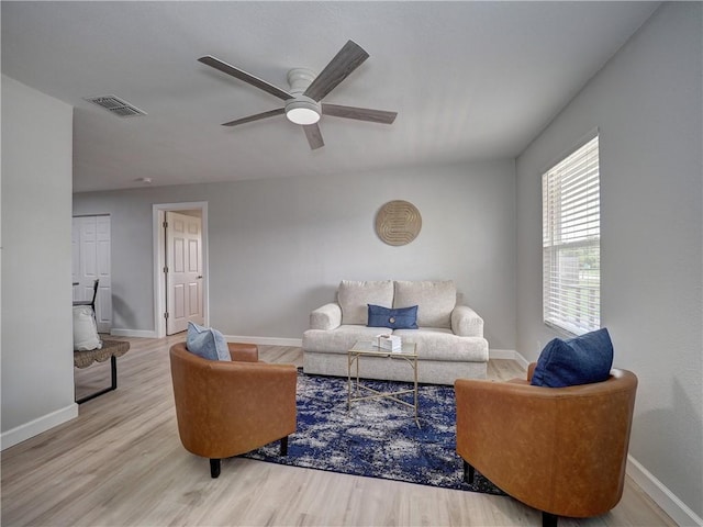 222 N 9th St, Aransas Pass, TX 78336 - living room featuring ceiling fan, wood finished floors, and baseboards