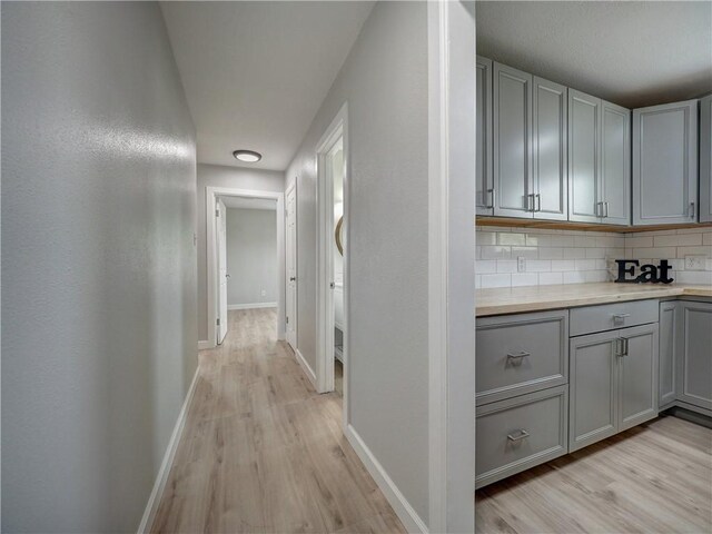 222 N 9th St, Aransas Pass, TX 78336 - hallway with light wood finished floors and baseboards