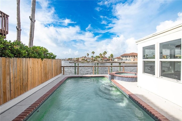 13765 Eaglesnest Bay Dr, Corpus Christi, TX 78418 - view of pool featuring a water view and a pool with connected hot tub