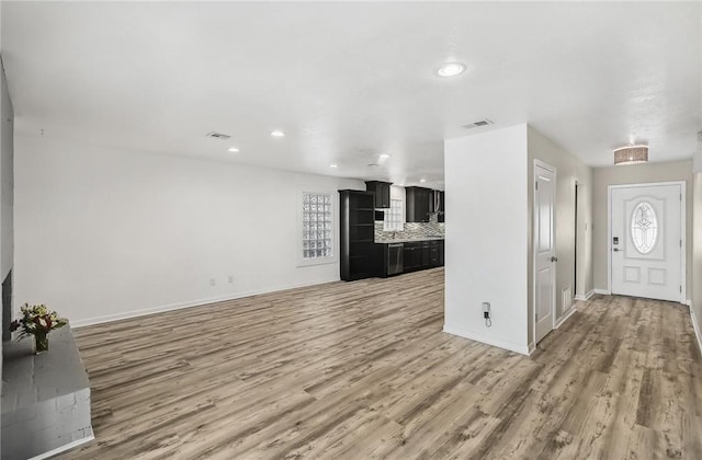 13765 Eaglesnest Bay Dr, Corpus Christi, TX 78418 - unfurnished living room with light wood-type flooring and recessed lighting