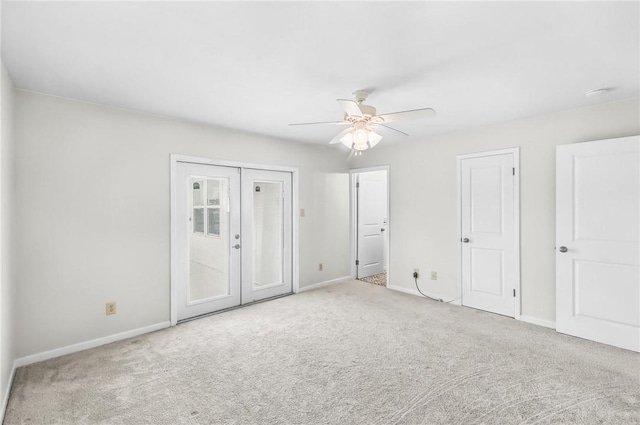 13765 Eaglesnest Bay Dr, Corpus Christi, TX 78418 - unfurnished bedroom with carpet floors, french doors, and a ceiling fan