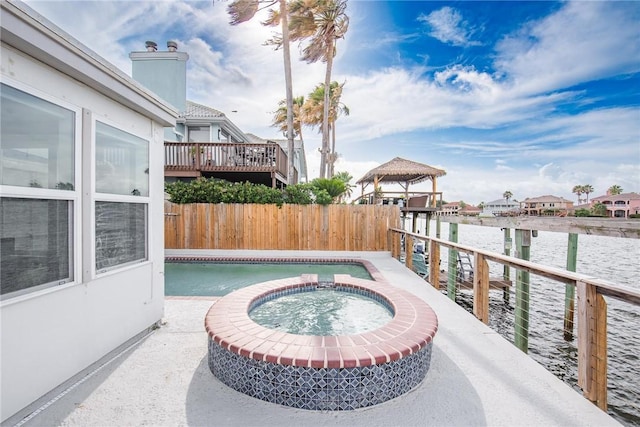 13765 Eaglesnest Bay Dr, Corpus Christi, TX 78418 - view of patio featuring a gazebo, a pool with connected hot tub, and a water view