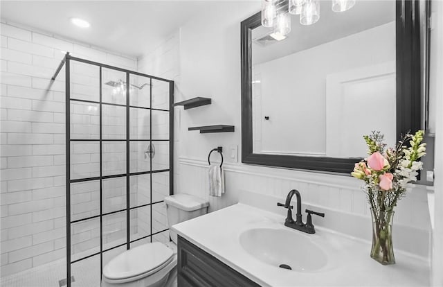 13765 Eaglesnest Bay Dr, Corpus Christi, TX 78418 - full bathroom with vanity, a shower stall, and wainscoting
