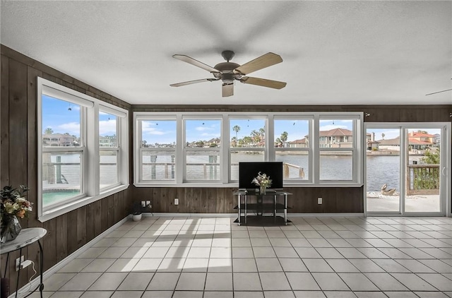 13765 Eaglesnest Bay Dr, Corpus Christi, TX 78418 - sunroom featuring wooden walls, tile patterned flooring, and a textured ceiling