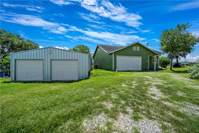 garage with a lawn