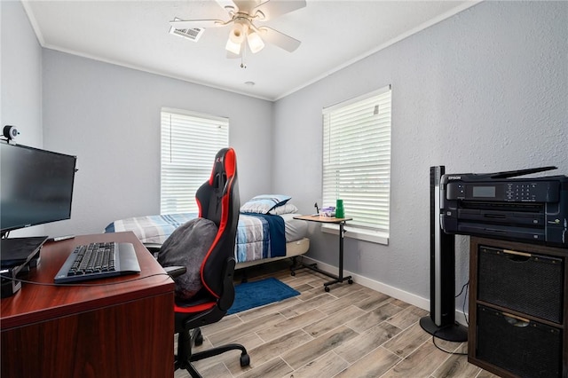 office area with light hardwood / wood-style flooring, ceiling fan, and ornamental molding