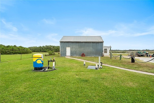 view of outbuilding with a yard