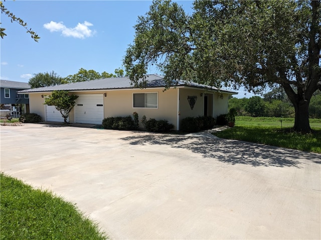 ranch-style house featuring a garage