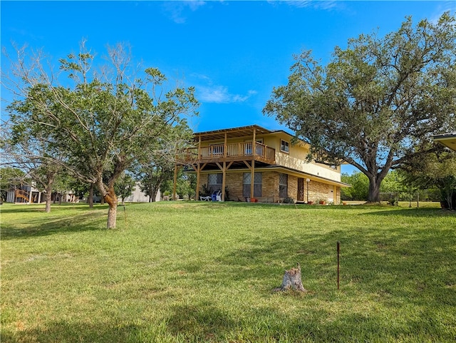 exterior space featuring a wooden deck and a front lawn