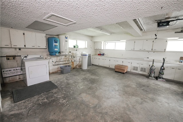 garage with washer / dryer and water heater