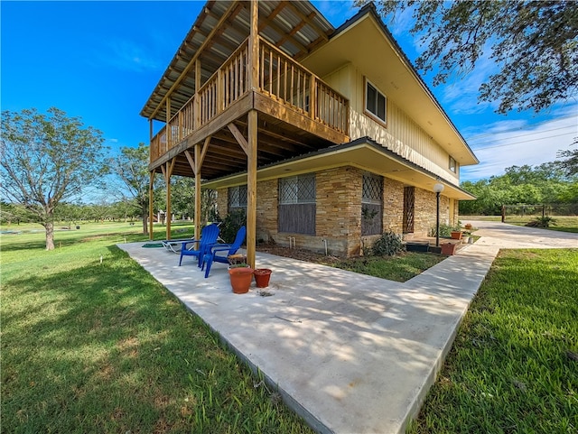 exterior space featuring a yard and a patio