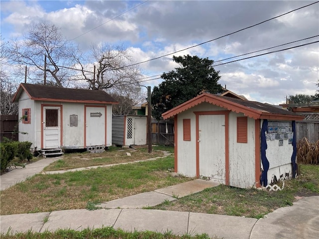 view of shed with fence