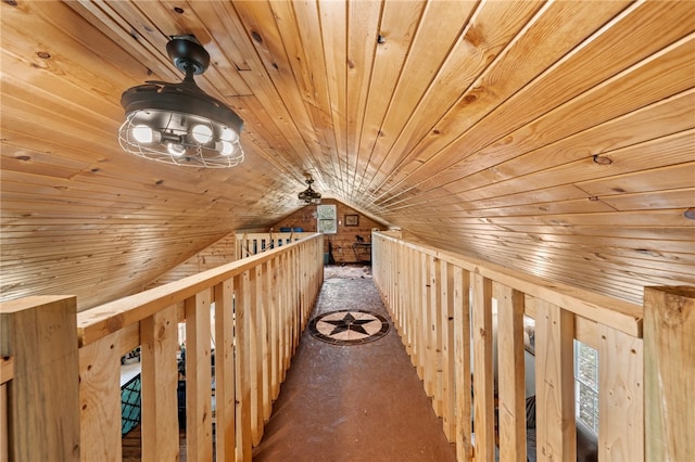 hallway with wood walls, lofted ceiling, and wooden ceiling