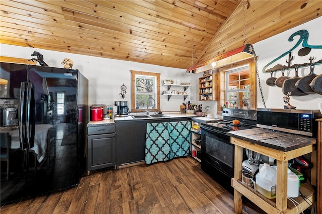 kitchen with lofted ceiling, dark wood-type flooring, black appliances, sink, and wooden ceiling