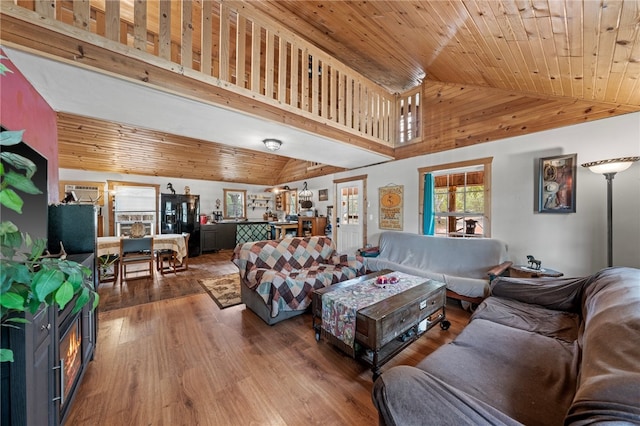 living room featuring high vaulted ceiling, hardwood / wood-style floors, and wooden ceiling