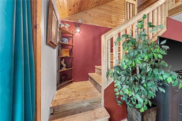 staircase featuring wooden ceiling