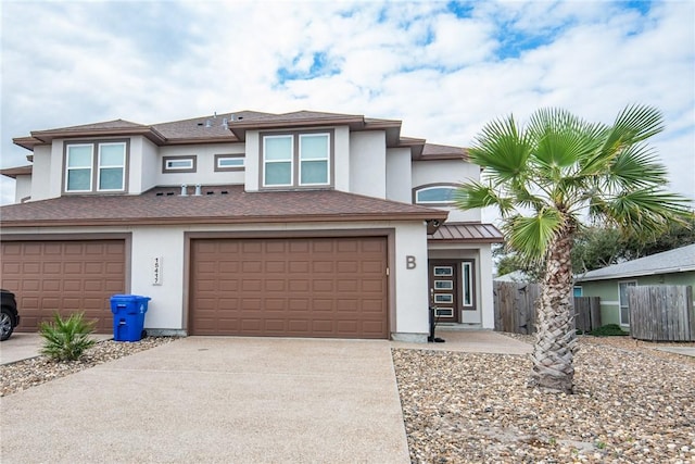 15417 Palmira Ave Unit B, Corpus Christi, TX 78418 - view of front of home featuring stucco siding, concrete driveway, and a garage