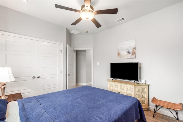15417 Palmira Ave Unit B, Corpus Christi, TX 78418 - bedroom with wood finished floors, baseboards, ceiling fan, and a closet