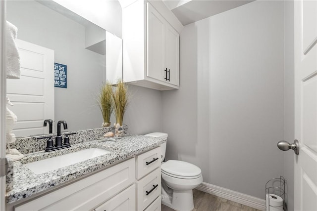 15417 Palmira Ave Unit B, Corpus Christi, TX 78418 - half bath with toilet, wood finished floors, vanity, and baseboards