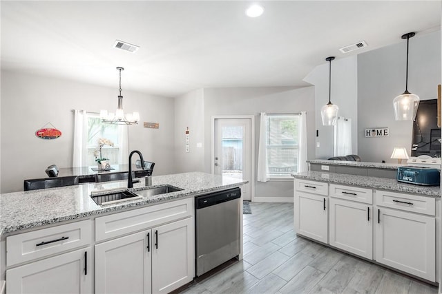 15417 Palmira Ave Unit B, Corpus Christi, TX 78418 - kitchen featuring stainless steel dishwasher, a sink, a chandelier, white cabinetry, and recessed lighting