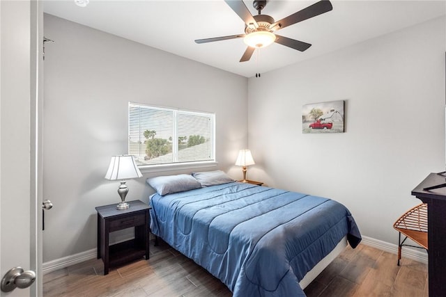 15417 Palmira Ave Unit B, Corpus Christi, TX 78418 - bedroom featuring wood finished floors, baseboards, and a ceiling fan