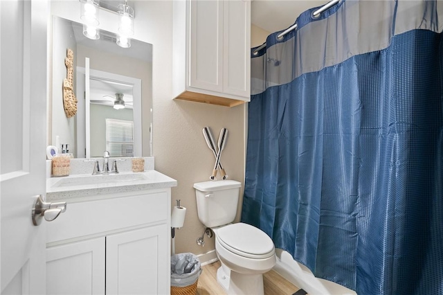268 Flounder Dr, Port Aransas, TX 78373 - bathroom featuring vanity, a ceiling fan, curtained shower, and wood finished floors