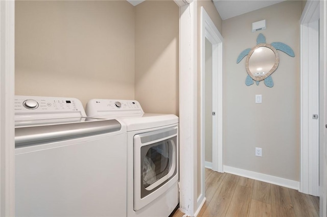 268 Flounder Dr, Port Aransas, TX 78373 - laundry area featuring washer and clothes dryer and light wood-type flooring