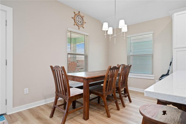 268 Flounder Dr, Port Aransas, TX 78373 - dining area with a chandelier and light wood-type flooring