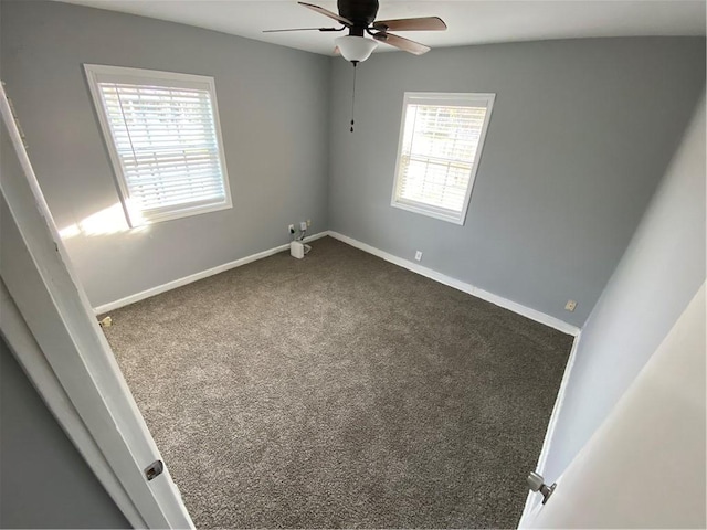 empty room featuring ceiling fan and carpet flooring