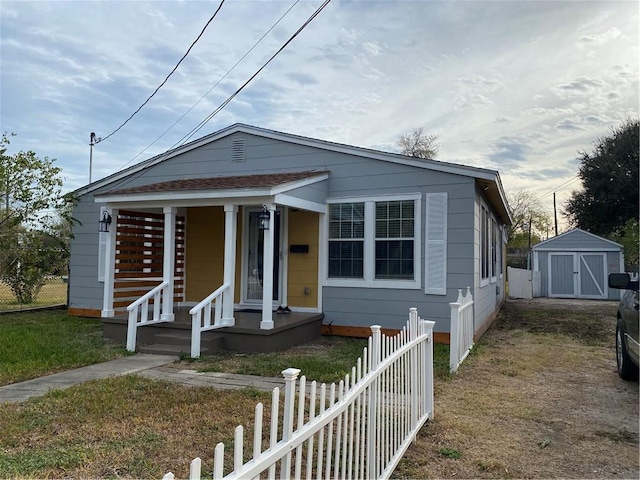 bungalow-style house featuring a shed