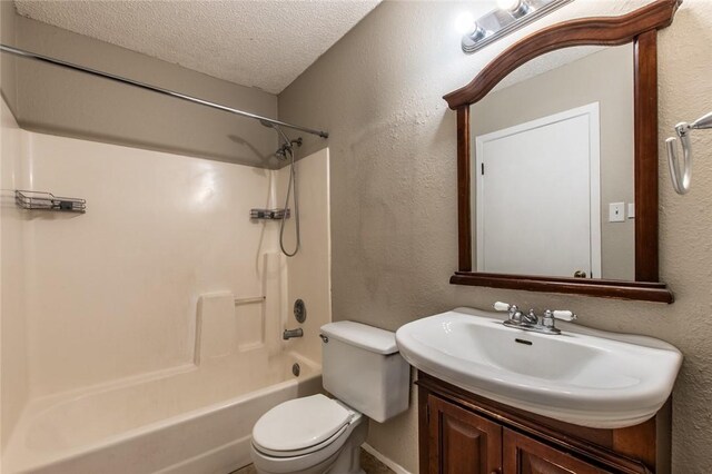 full bath with vanity, tub / shower combination, a textured ceiling, toilet, and a textured wall