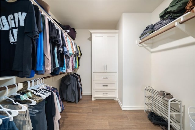 walk in closet featuring light wood-type flooring