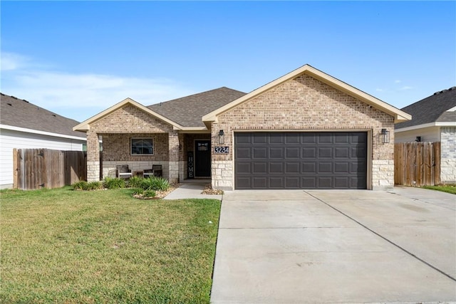 view of front of property with a garage and a front yard