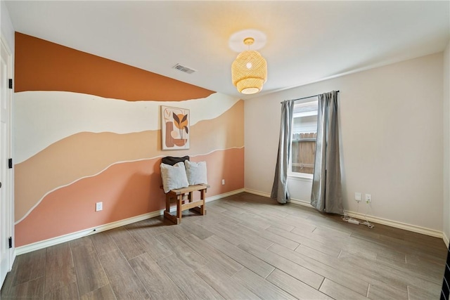 spare room with light wood-type flooring