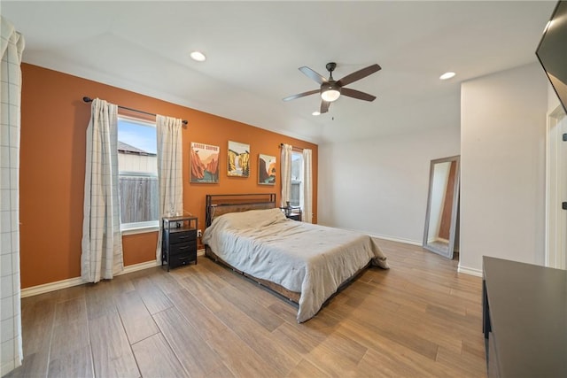 bedroom featuring ceiling fan and light hardwood / wood-style floors