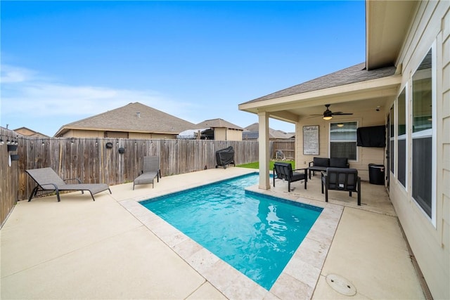 view of swimming pool featuring outdoor lounge area, ceiling fan, and a patio