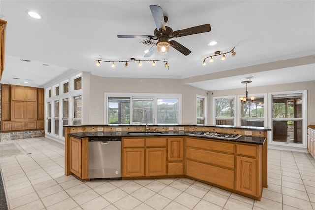 kitchen featuring light tile patterned flooring, ornamental molding, appliances with stainless steel finishes, hanging light fixtures, and sink