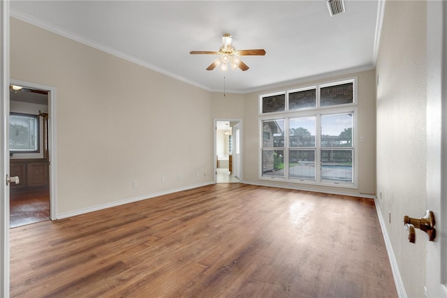 unfurnished room with ceiling fan, hardwood / wood-style floors, and ornamental molding