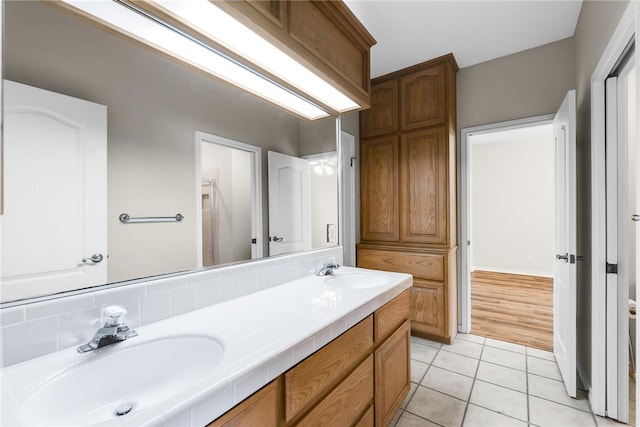 bathroom with tile patterned flooring and vanity