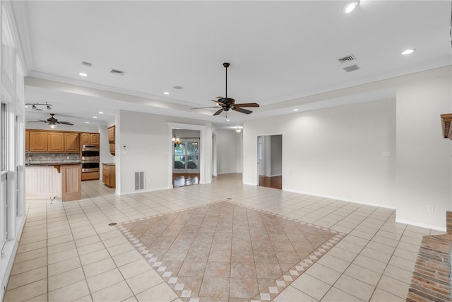 unfurnished living room featuring ornamental molding, ceiling fan, and light tile patterned flooring