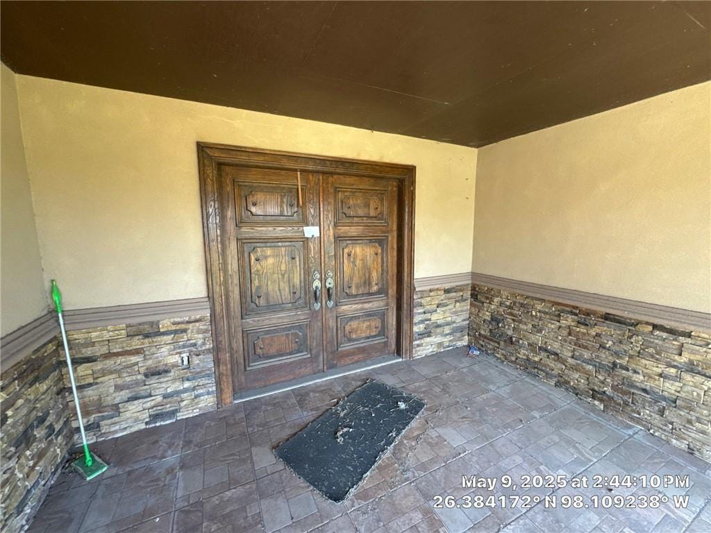 3309 Tulipan Ave, Edinburg, TX 78542 - doorway to property with stucco siding, stone siding, and french doors