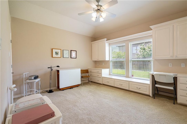 laundry room featuring light colored carpet and ceiling fan