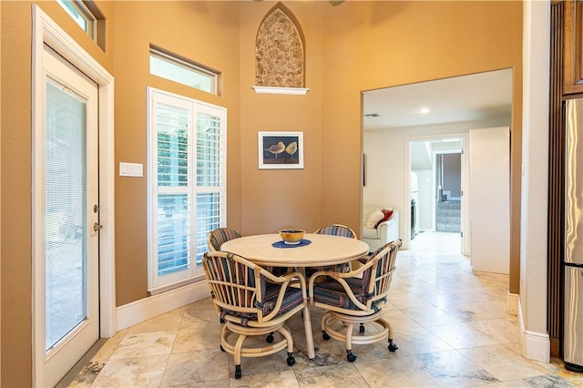 dining room featuring a high ceiling