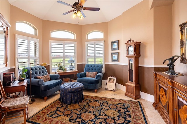 sitting room with light tile patterned floors and ceiling fan