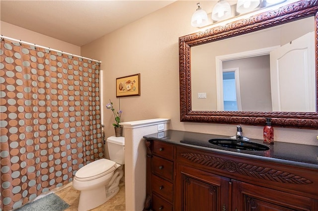 bathroom featuring vanity, tile patterned floors, and toilet