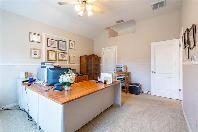 carpeted home office featuring vaulted ceiling and ceiling fan