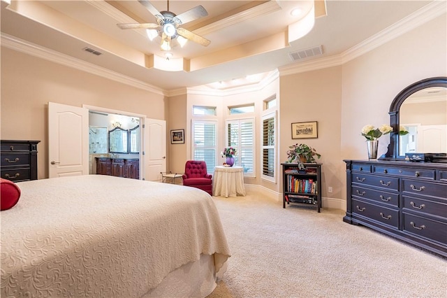 carpeted bedroom featuring ensuite bathroom, ceiling fan, ornamental molding, and a raised ceiling